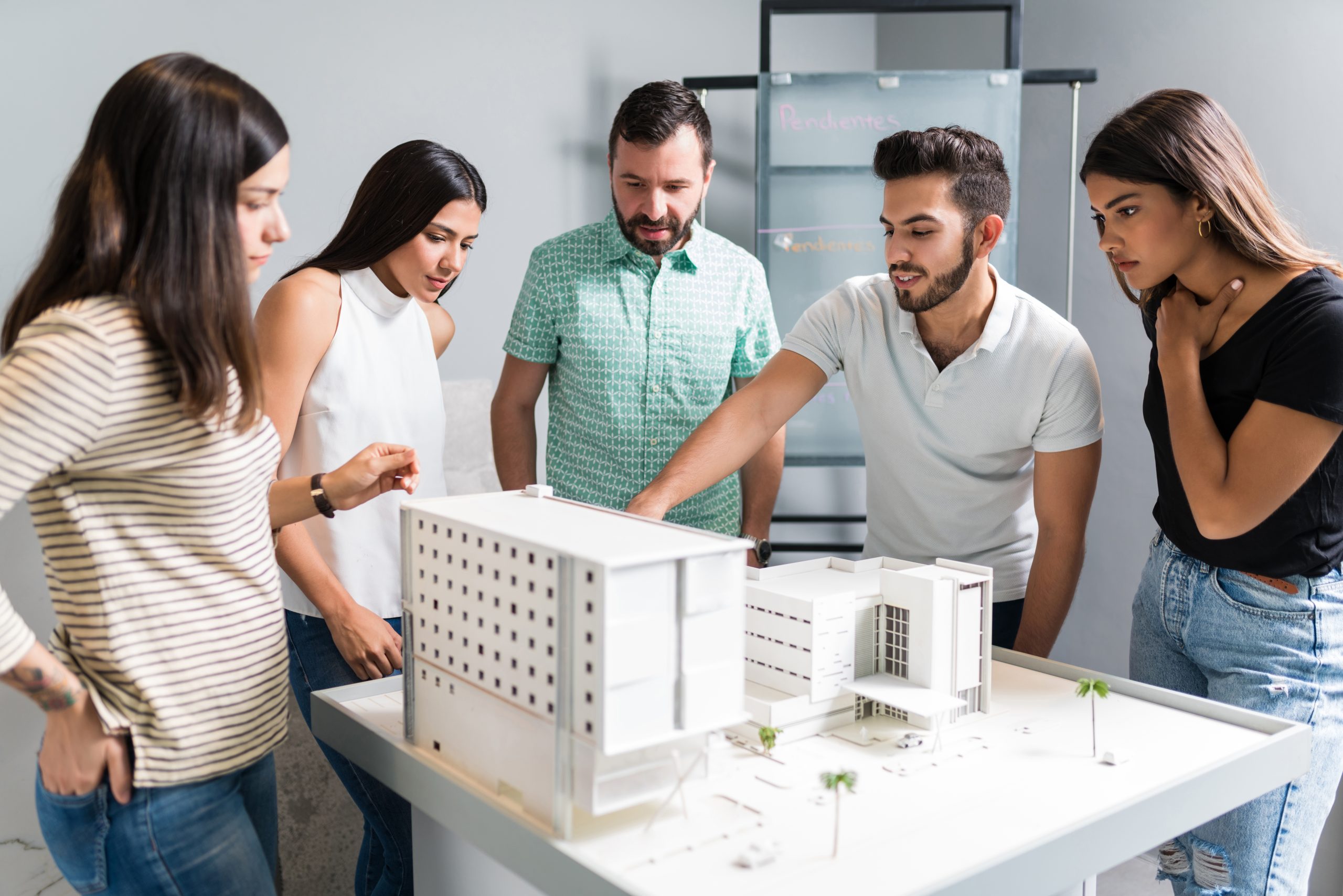hispanic-architectural-team-planning-new-project-office.jpg